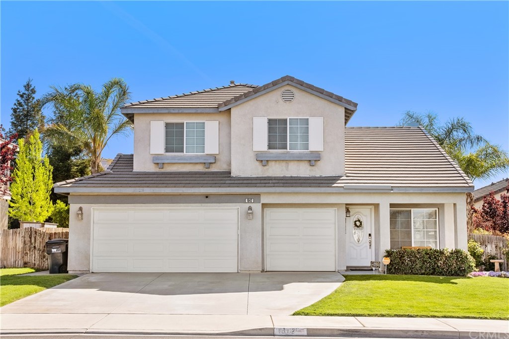 1642 Ravenswood Road Beaumont, CA 92223 - Photo 1 of 1 Front view with 3 car garage and extended driveway parking.