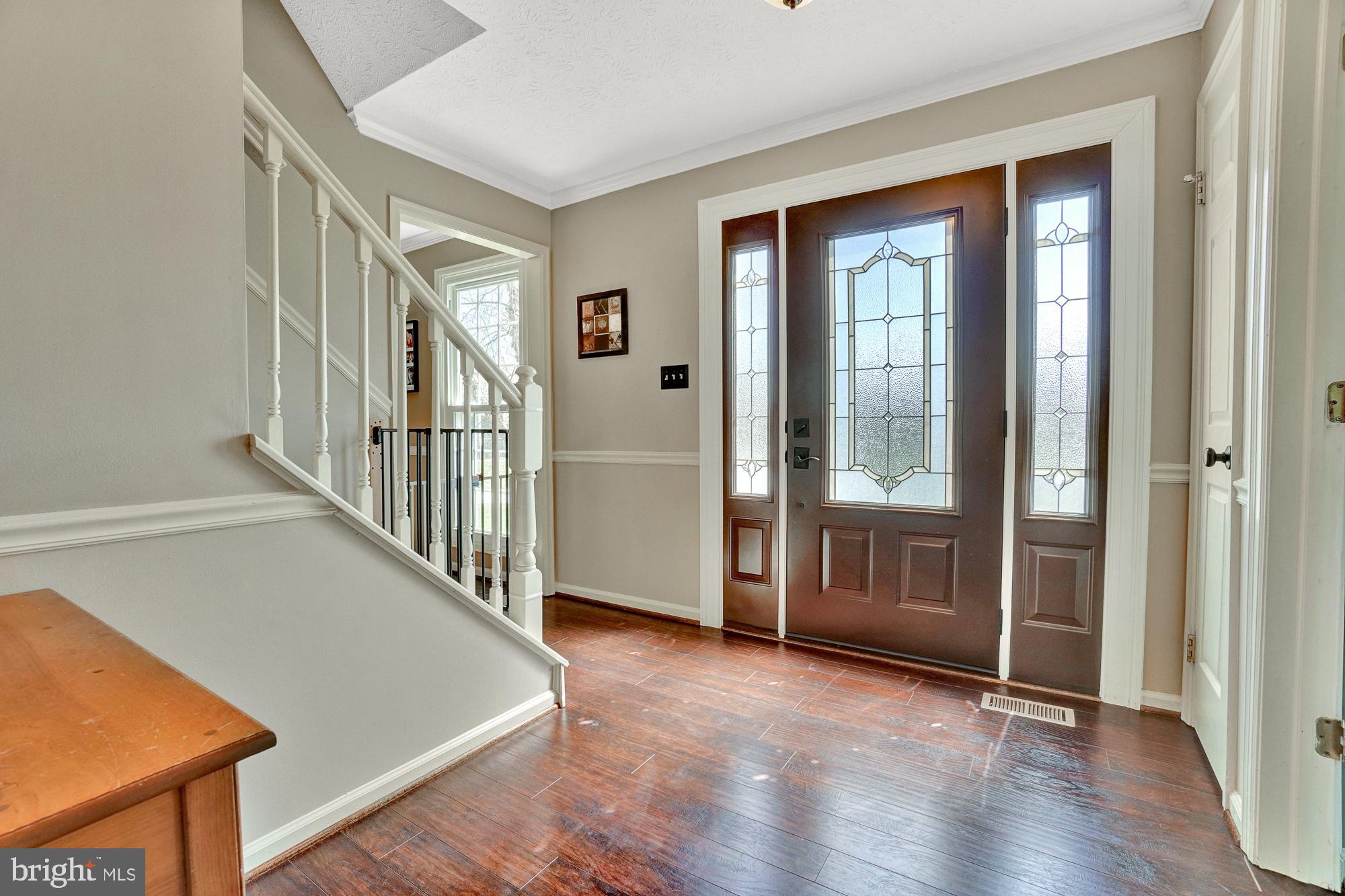 17233 Spates Hill Road Poolesville, MD 20837 - Photo 20 of 66 Majestic foyer with new front door and hardwoods