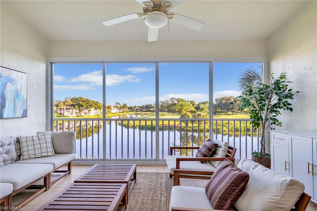 a bedroom with furniture and a large window