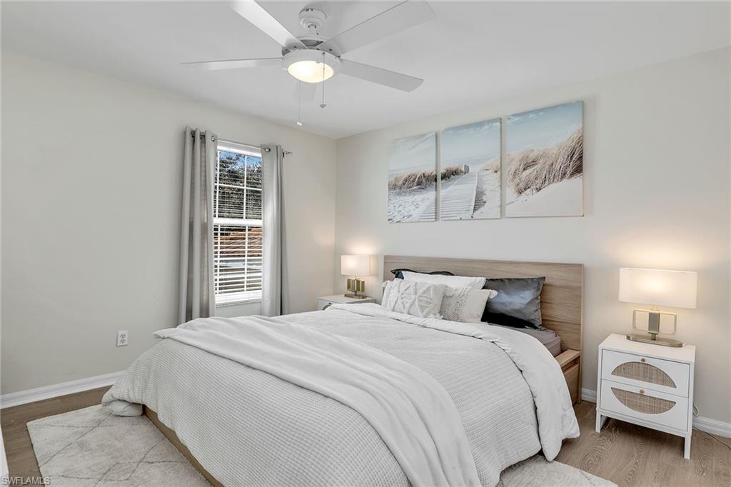 9189 Spring Run Boulevard, Unit 1908 Estero, FL 34135 - Photo 15 of 33 a bedroom with a large bed and a window