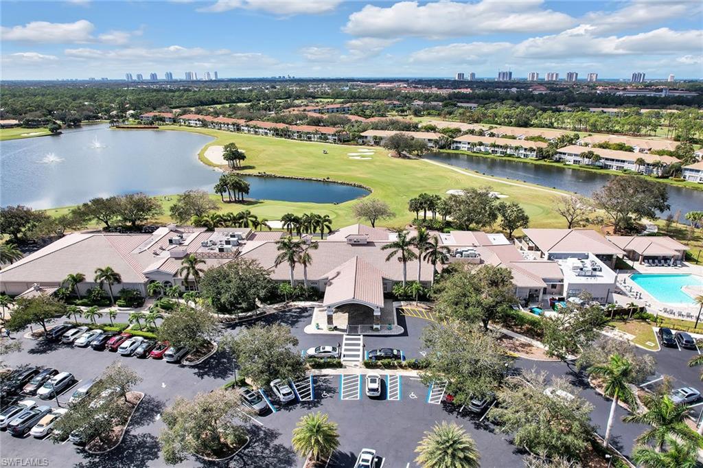 9189 Spring Run Boulevard, Unit 1908 Estero, FL 34135 - Photo 20 of 33 an aerial view of residential houses with outdoor space and lake view