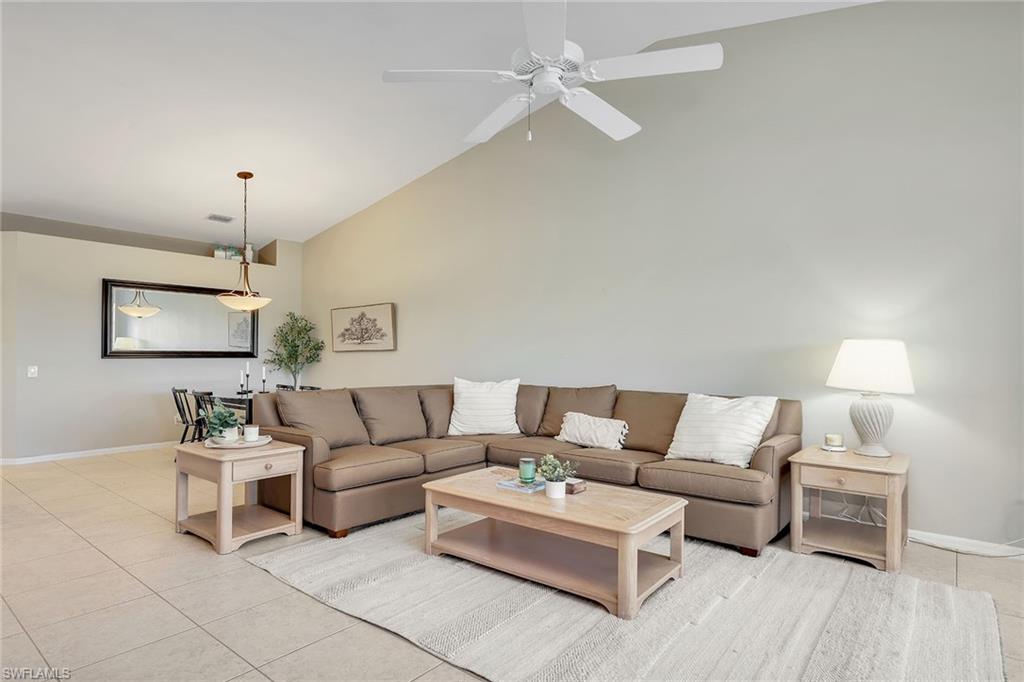 9189 Spring Run Boulevard, Unit 1908 Estero, FL 34135 - Photo 2 of 33 a living room with furniture and a wooden floor