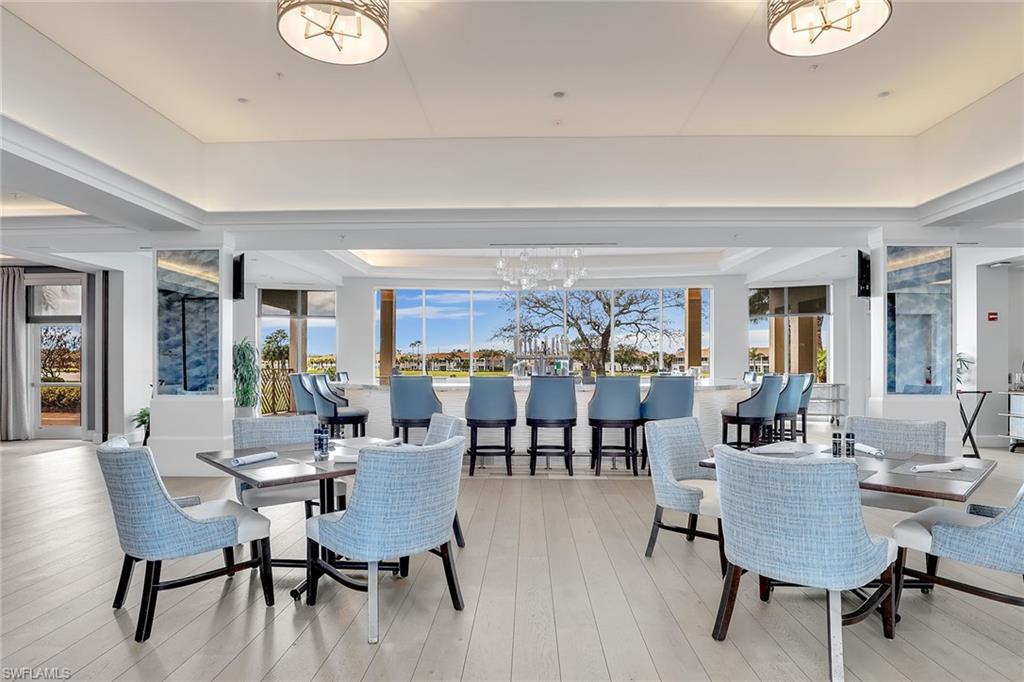 9189 Spring Run Boulevard, Unit 1908 Estero, FL 34135 - Photo 22 of 33 a view of a dining room with furniture