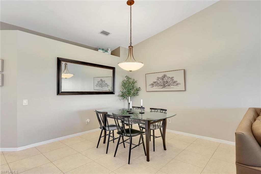 9189 Spring Run Boulevard, Unit 1908 Estero, FL 34135 - Photo 7 of 33 a view of a dining room with furniture