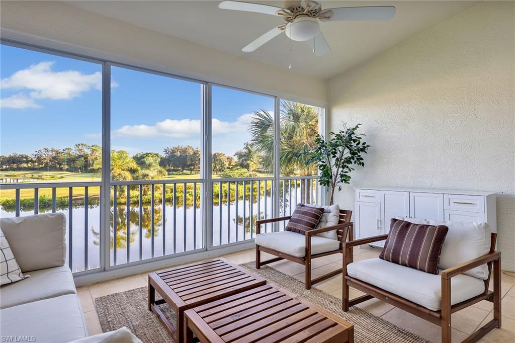 9189 Spring Run Boulevard, Unit 1908 Estero, FL 34135 - Photo 10 of 33 a living room with furniture and a large window