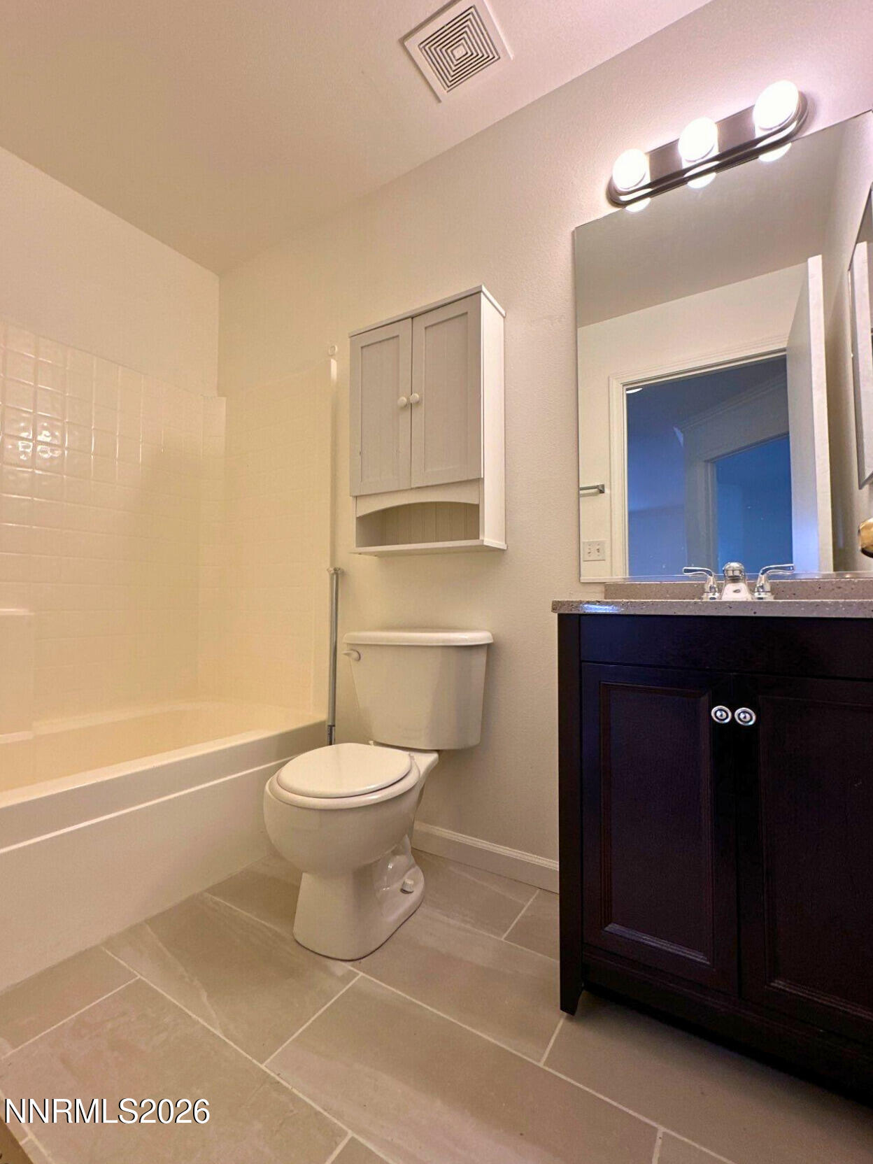 8675 Crimson Sky Court Reno, NV 89506 - Photo 12 of 16 a bathroom with a toilet a sink and bathtub