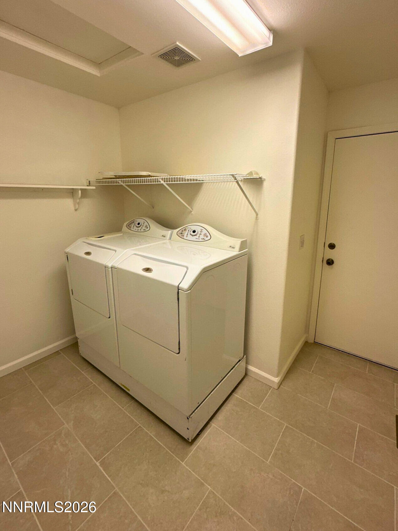 8675 Crimson Sky Court Reno, NV 89506 - Photo 13 of 16 a utility room with dryer and washer