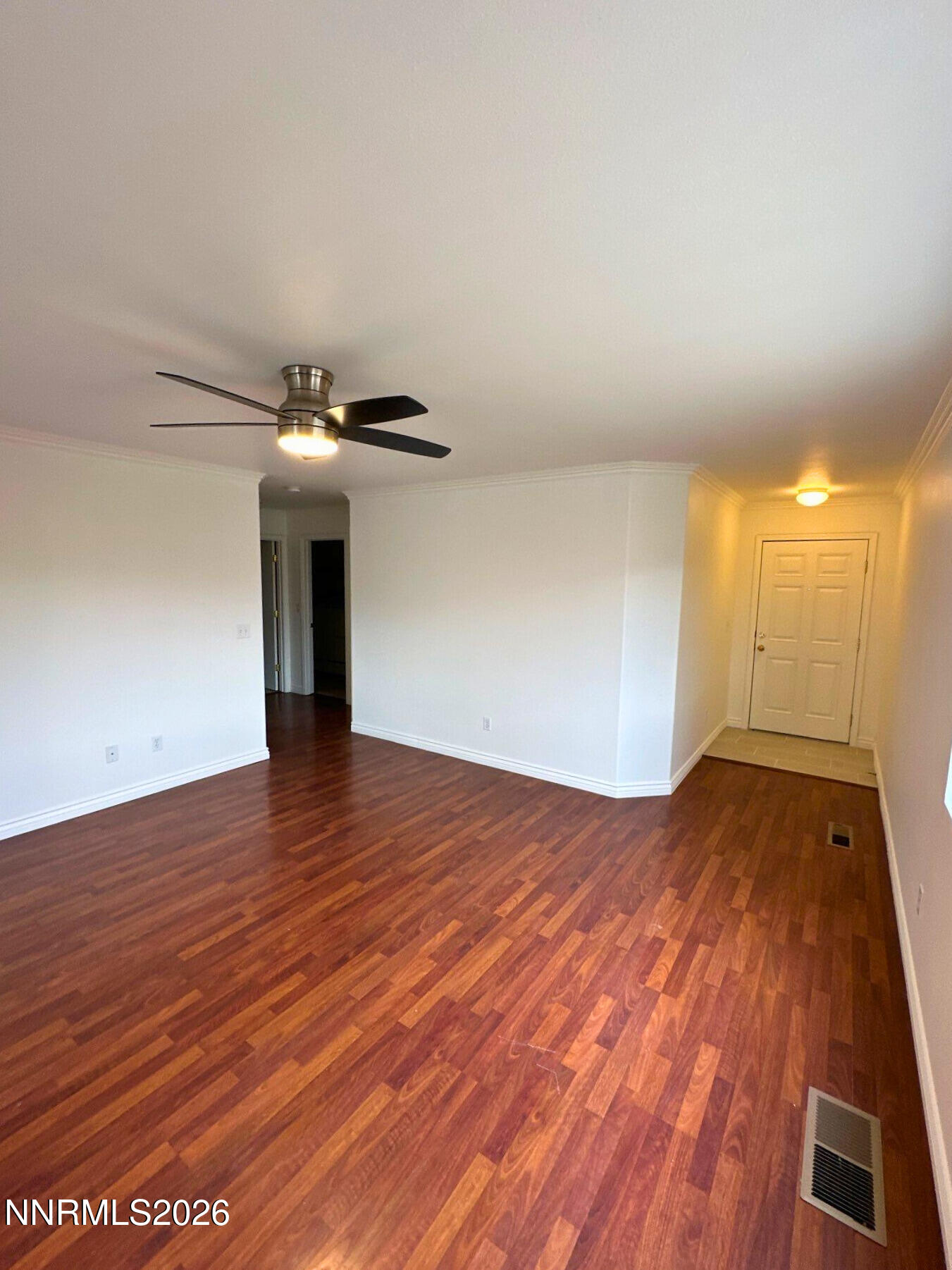 8675 Crimson Sky Court Reno, NV 89506 - Photo 2 of 16 a view of empty room with wooden floor