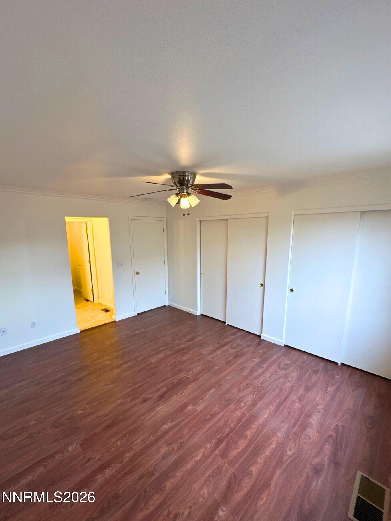 8675 Crimson Sky Court Reno, NV 89506 - Photo 8 of 16 a view of empty room with wooden floor