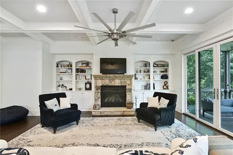 a large kitchen with a table and chairs