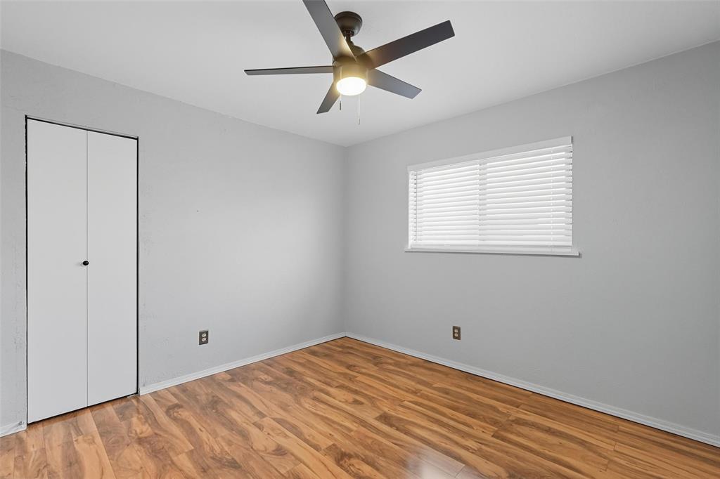 6108 Jennings Drive The Colony, TX 75056 - Photo 13 of 32 a view of a room with a ceiling fan and a window