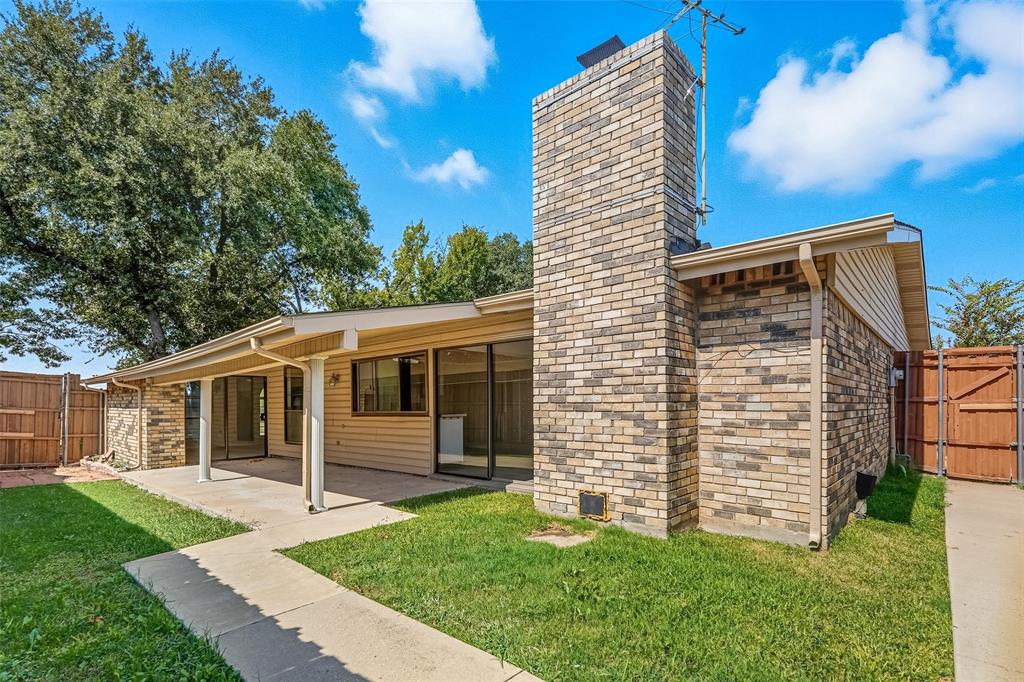 6108 Jennings Drive The Colony, TX 75056 - Photo 27 of 32 a front view of a house with a garden