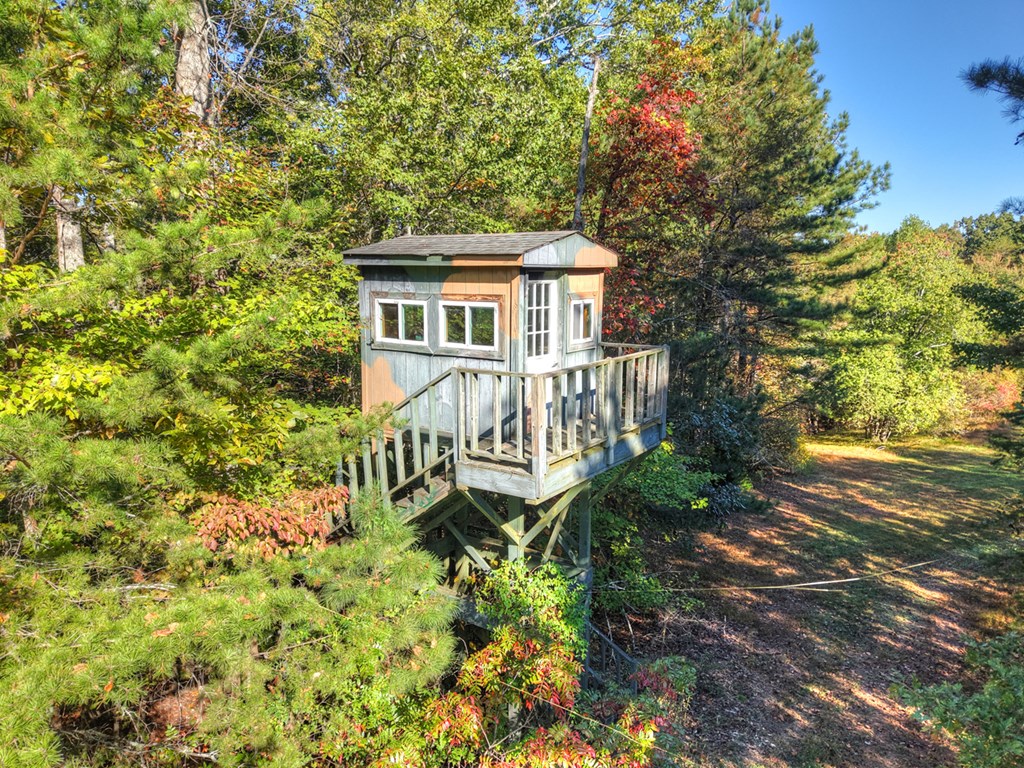 523 Long Branch Road Ranger, GA 30734 - Photo 11 of 56 a front view of a house with a garden