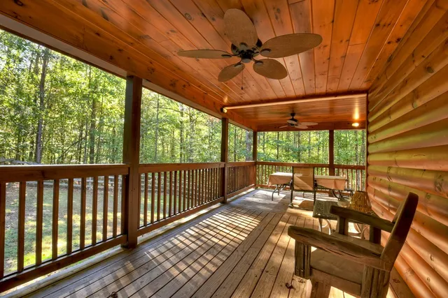 a view of a porch with wooden floor and outdoor space