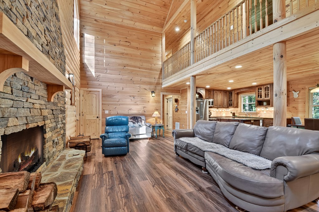 523 Long Branch Road Ranger, GA 30734 - Photo 26 of 56 a living room with furniture and a fireplace