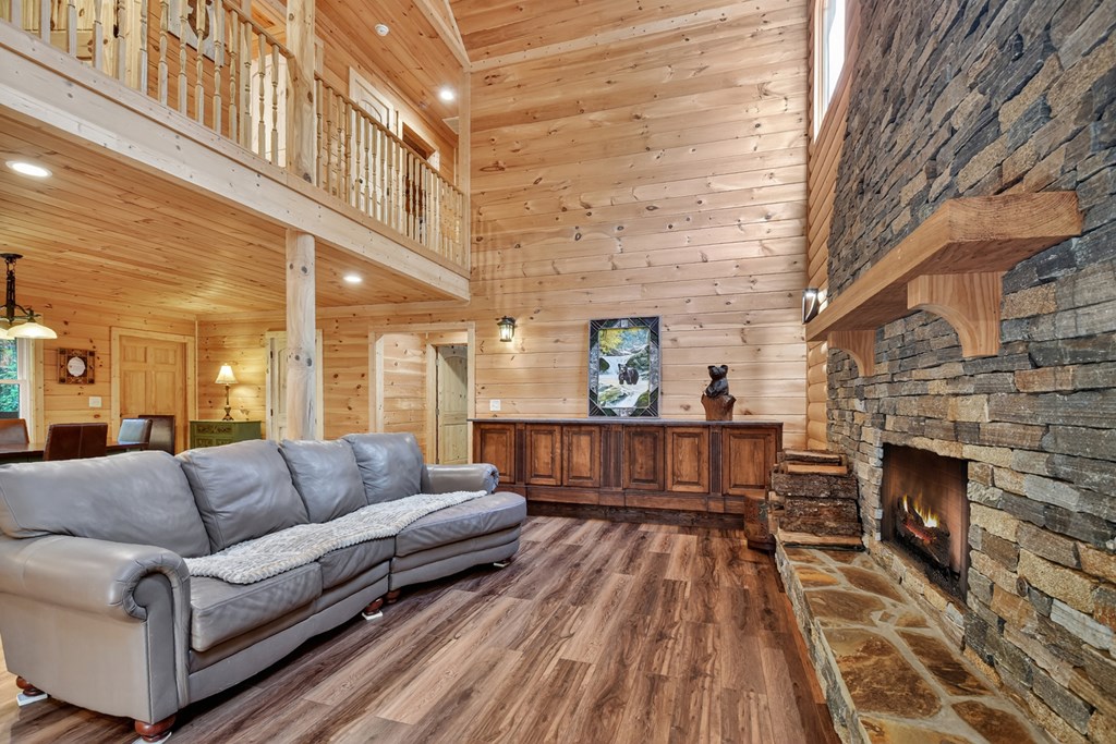 523 Long Branch Road Ranger, GA 30734 - Photo 27 of 56 a view of a living room filled with furniture and a fireplace