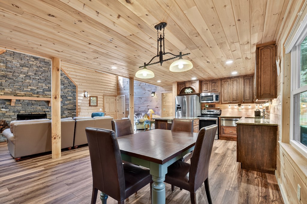 523 Long Branch Road Ranger, GA 30734 - Photo 29 of 56 a view of a dining room with furniture window and wooden floor