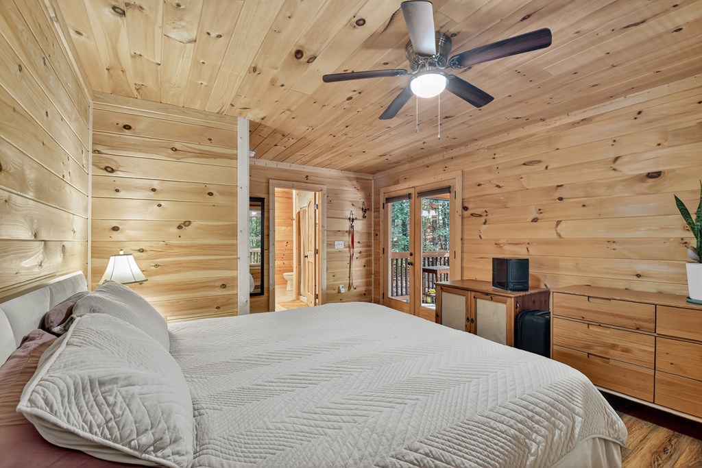 523 Long Branch Road Ranger, GA 30734 - Photo 37 of 56 a bedroom with a bed and a dresser