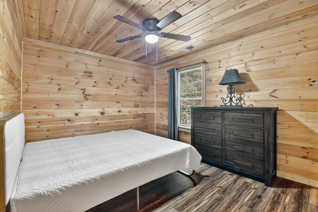 523 Long Branch Road Ranger, GA 30734 - Photo 44 of 56 a bedroom with a bed and a dresser