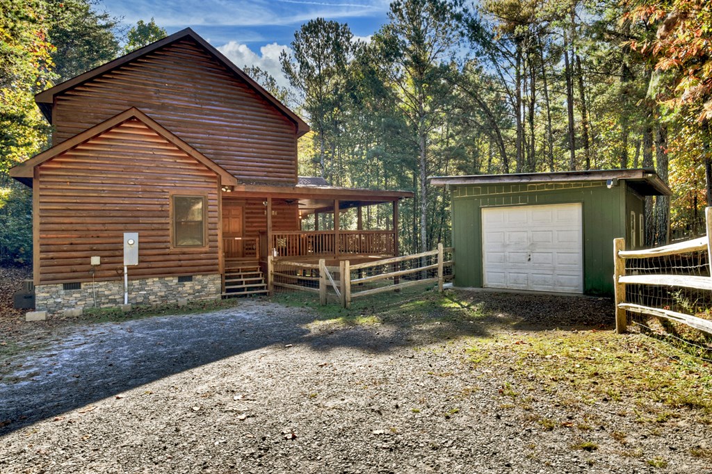 523 Long Branch Road Ranger, GA 30734 - Photo 55 of 56 a view of a house with a yard and a large tree