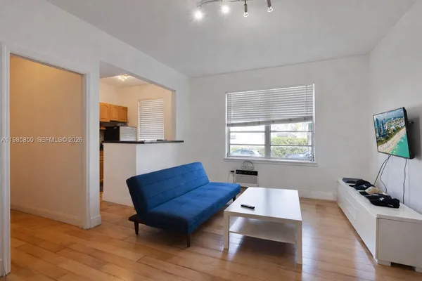 a living room with furniture and a window