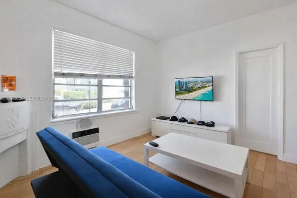 a work room with furniture and a window