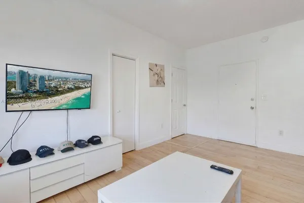 a bedroom with bed and cabinets