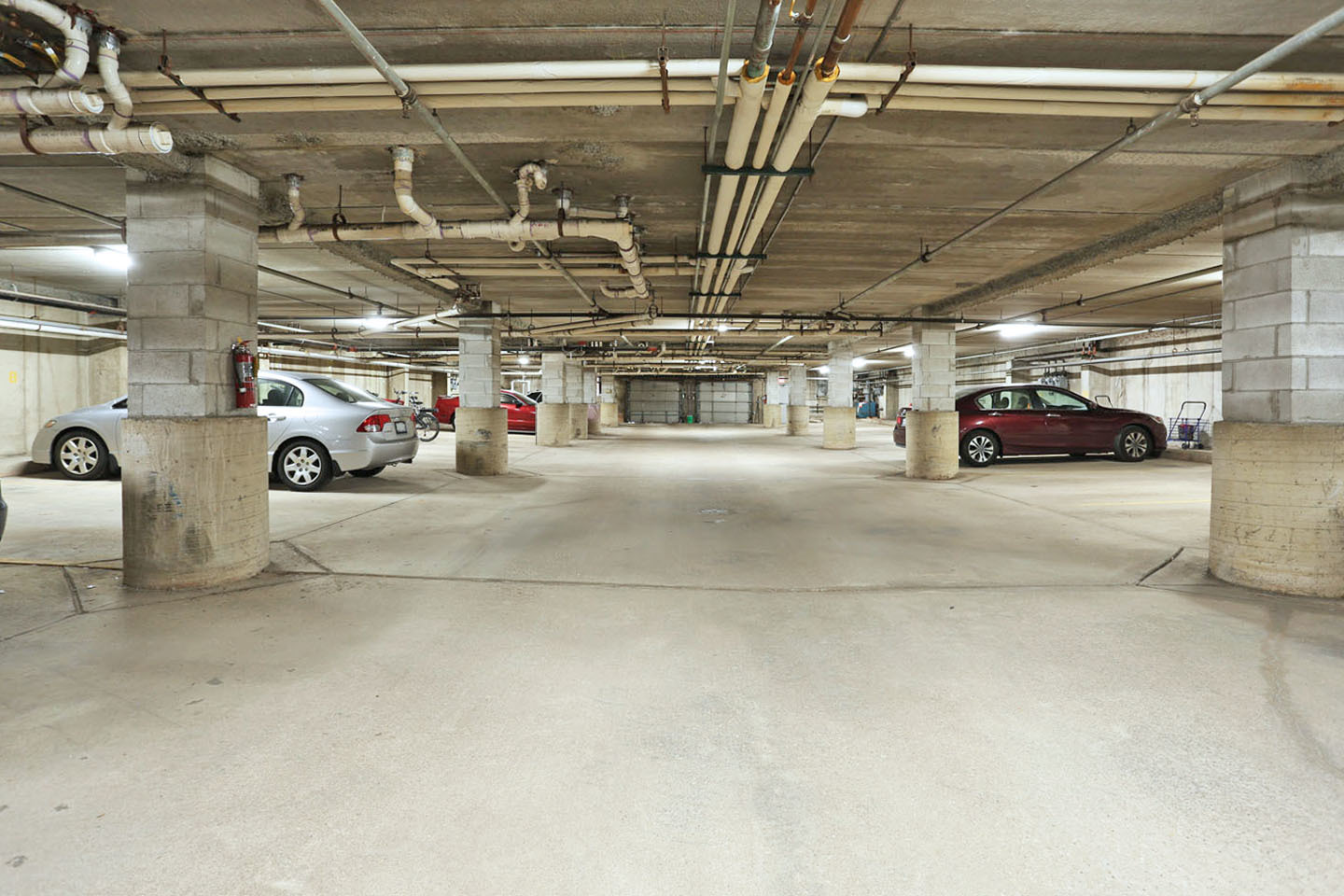 815 Leicester Road, Unit 108 Elk Grove Village, IL 60007 - Photo 32 of 34 a view of parking garage with cars