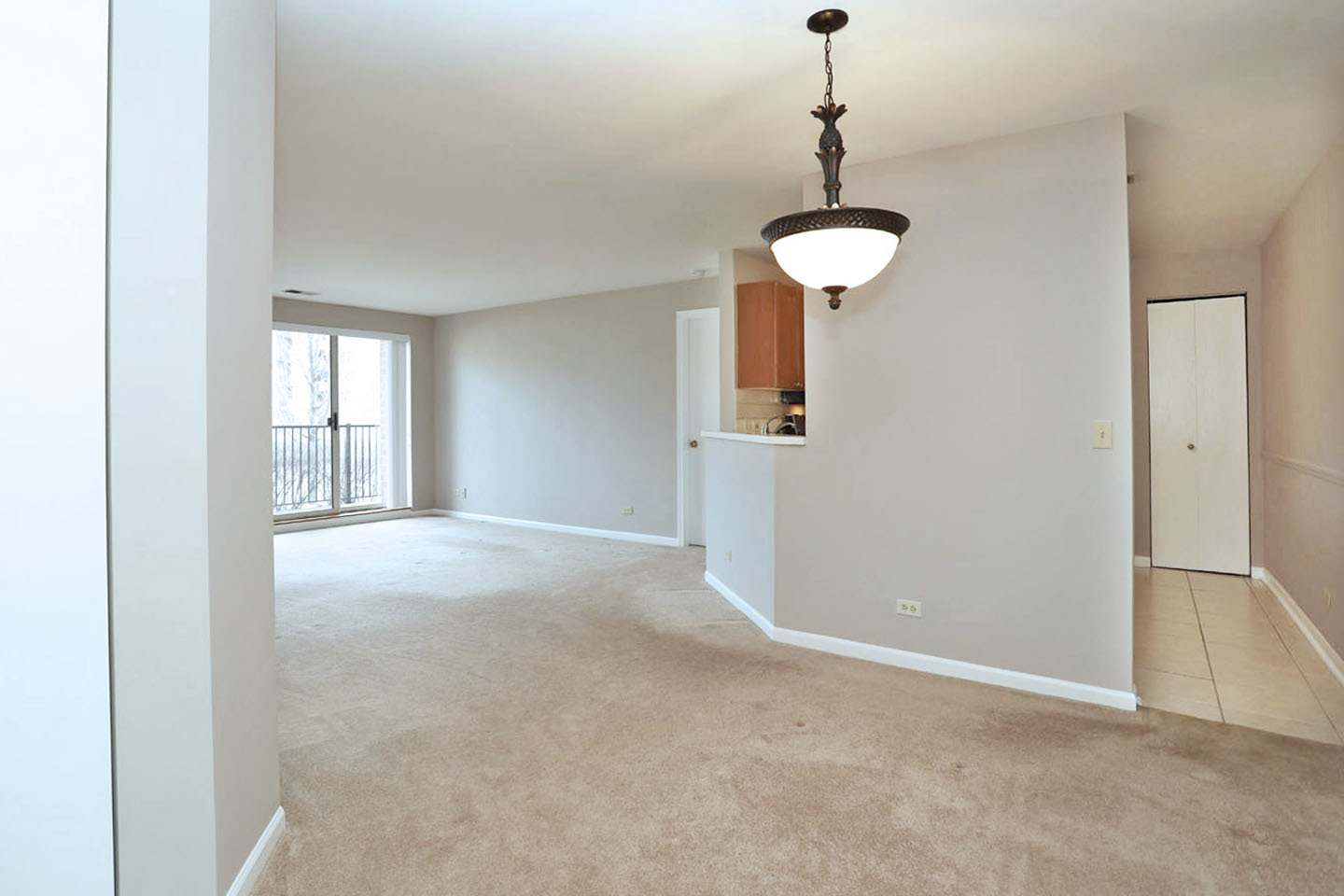 815 Leicester Road, Unit 108 Elk Grove Village, IL 60007 - Photo 10 of 34 a view of an empty room with a window