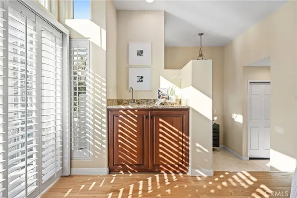 a spacious bedroom with a bed and a table
