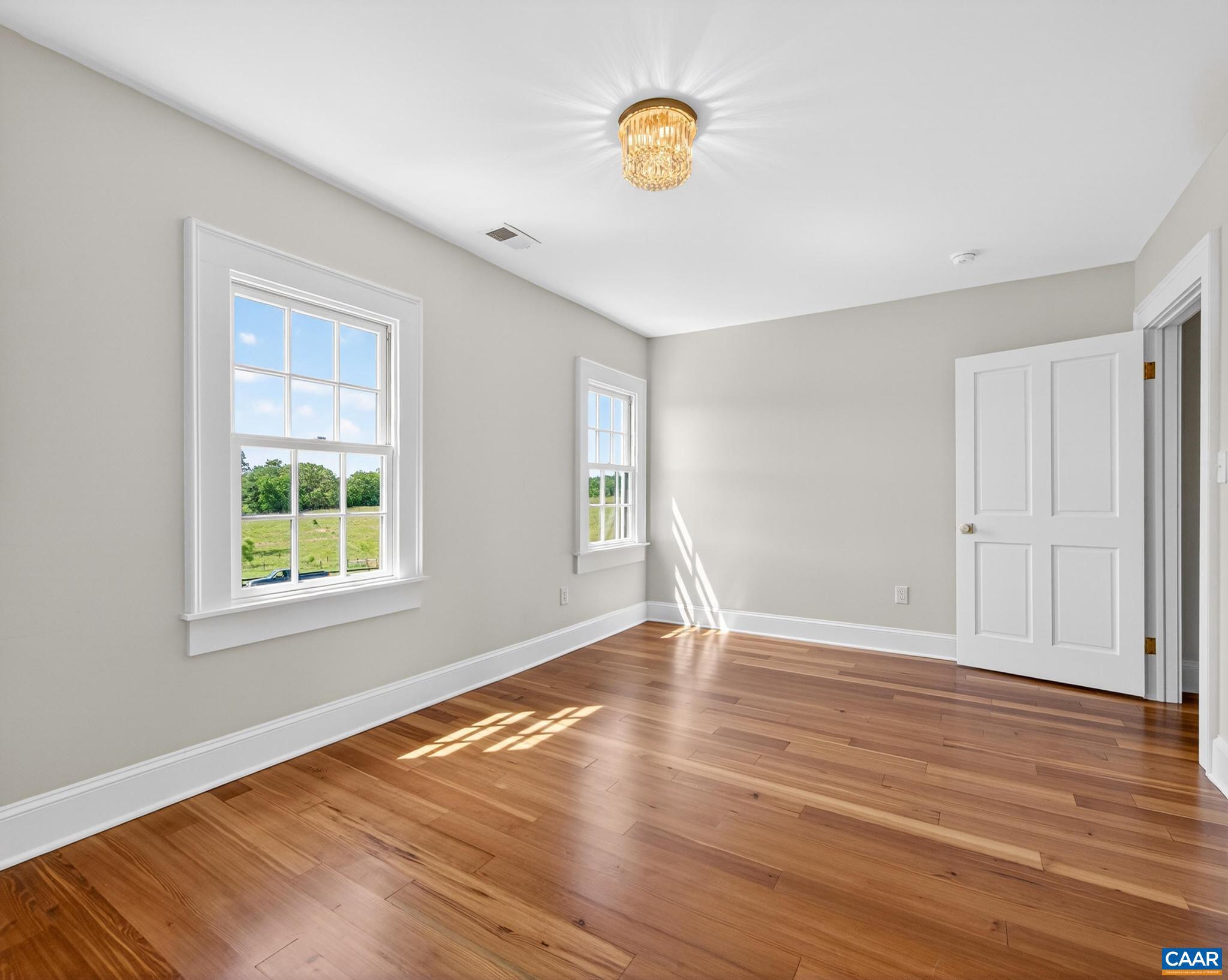 481 Race Ground Road Somerset, VA 22972 - Photo 30 of 53 a view of an empty room with wooden floor and a window