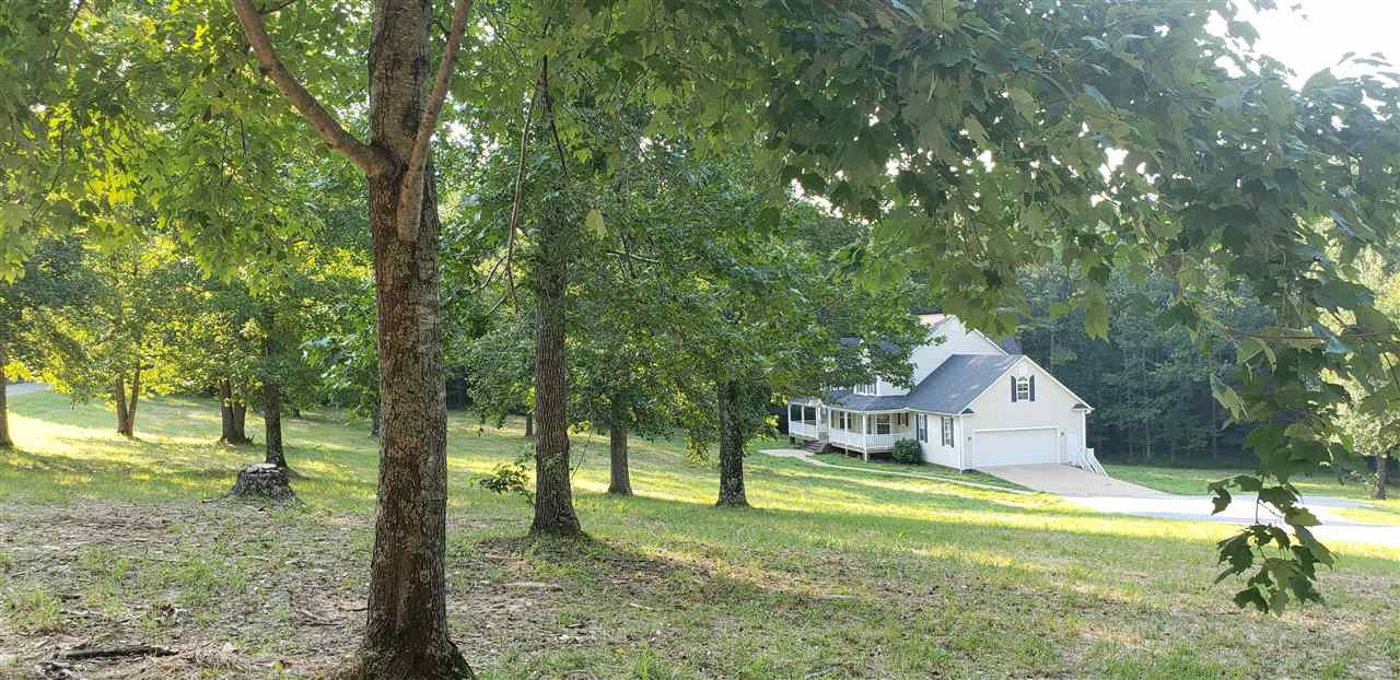 292 Gilbert Road Parsons, TN 38363 - Photo 1 of 16 a front view of a house with a yard and trees