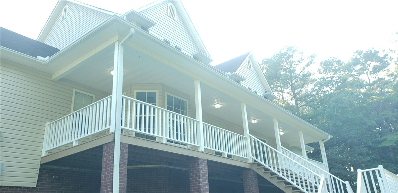 292 Gilbert Road Parsons, TN 38363 - Photo 5 of 16 a view of balcony with wooden floor and fence