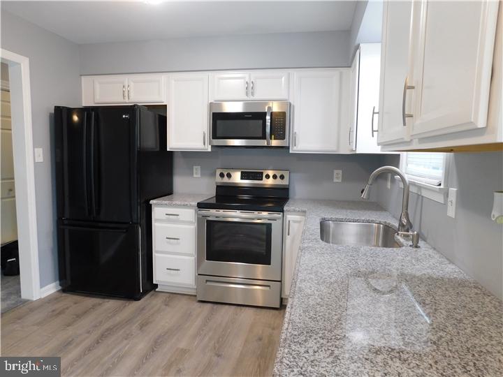35 Cimarron Circle Elkton, MD 21921 - Photo 6 of 17 a kitchen with stainless steel appliances granite countertop a refrigerator stove and sink