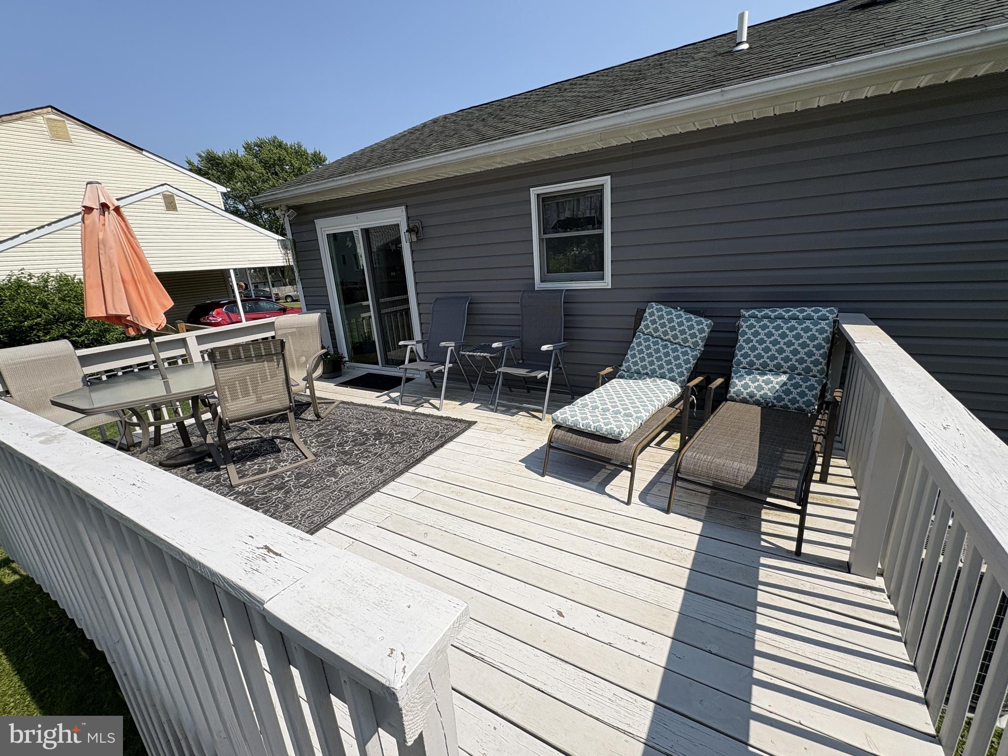 35 Cimarron Circle Elkton, MD 21921 - Photo 9 of 17 a view of a patio with couches chairs and wooden floor