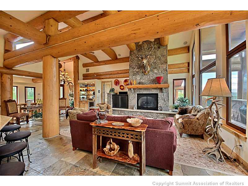 2560 Hunter's Knob Road Silverthorne, CO 80498 - Photo 3 of 25 Living Room. Moss rock surround gas fireplace
