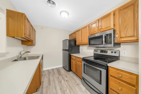 $374,900 | 3 Bartemus Trail, Unit 202, Nashua, NH 03063