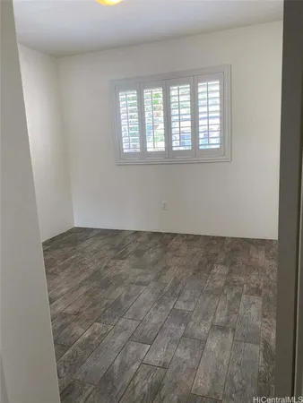an empty room with a empty space and windows