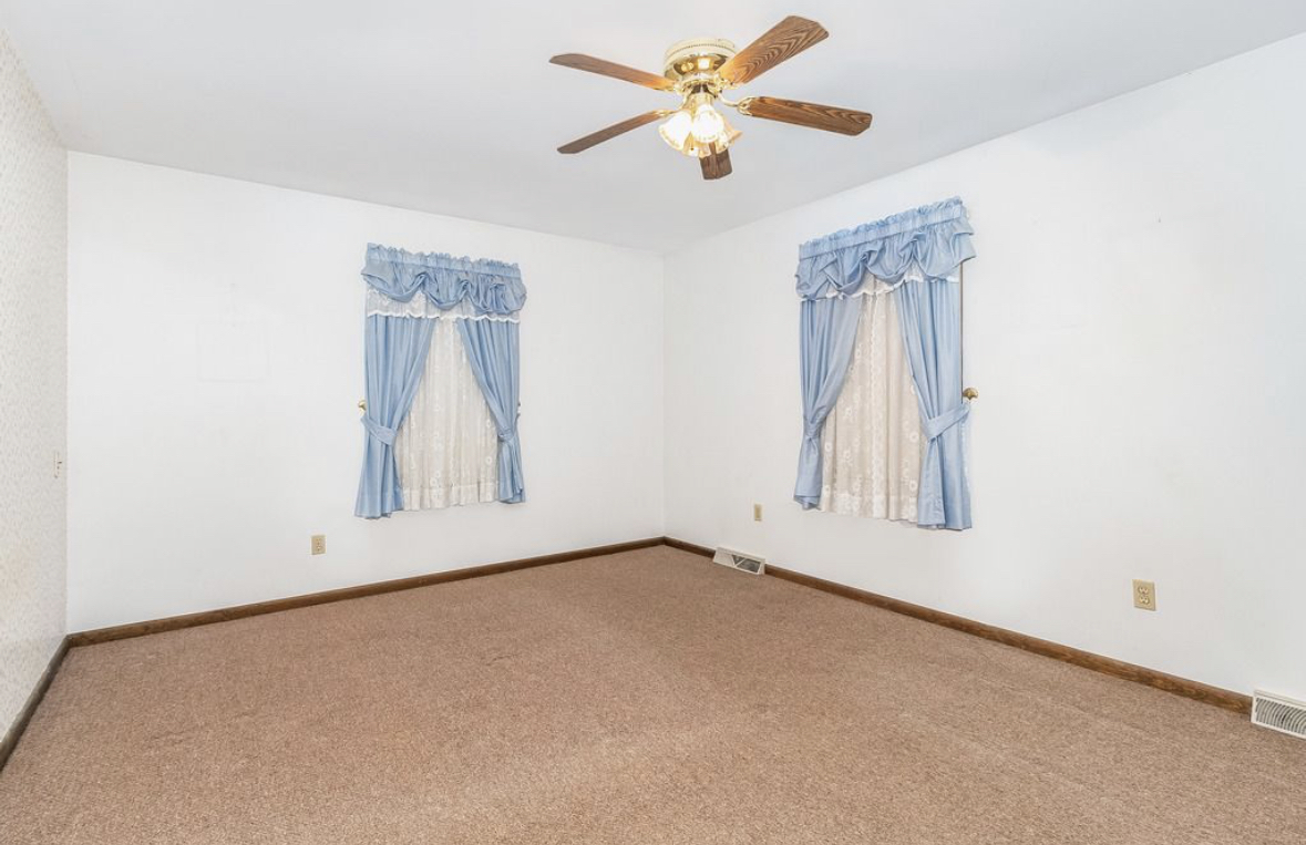 1943 Church Road Aurora, IL 60505 - Photo 11 of 31 an empty room with windows and fan
