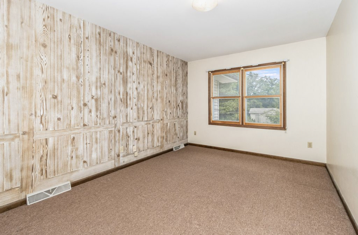1943 Church Road Aurora, IL 60505 - Photo 12 of 31 a view of an empty room with a window