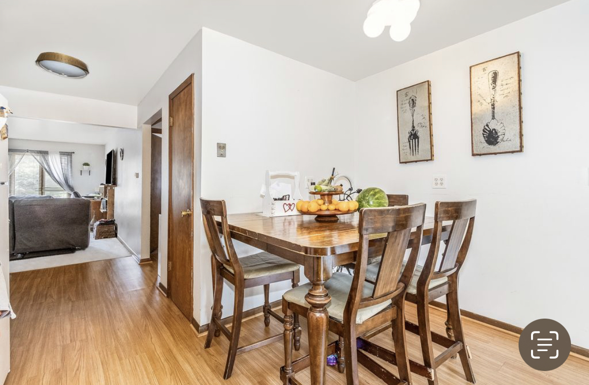 1943 Church Road Aurora, IL 60505 - Photo 18 of 31 a view of a dining room with furniture and wooden floor