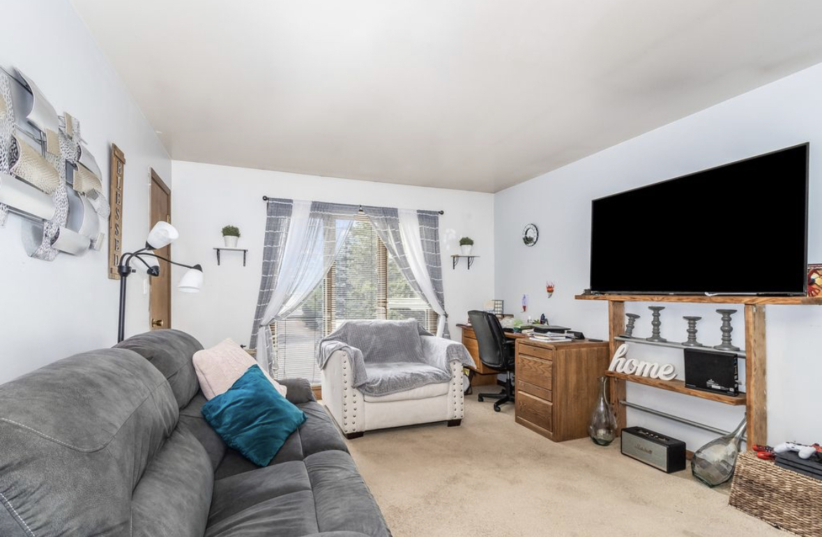 1943 Church Road Aurora, IL 60505 - Photo 19 of 31 a living room with furniture and a flat screen tv