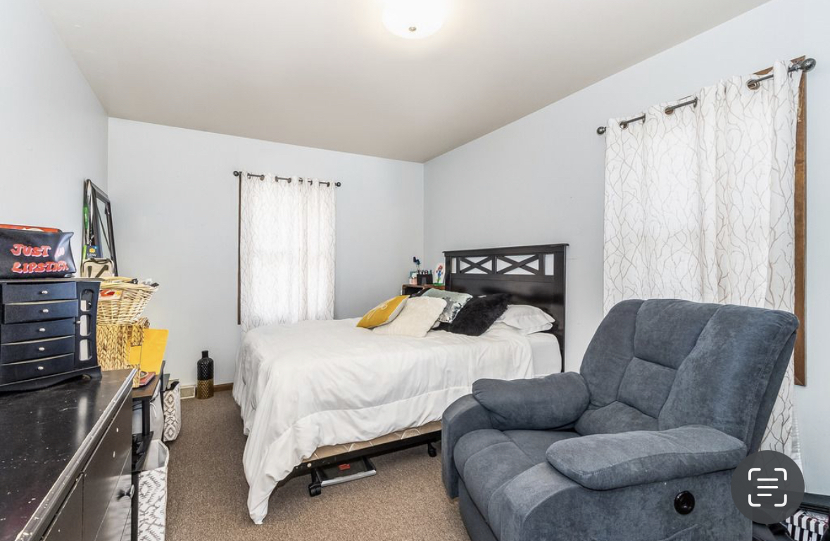 1943 Church Road Aurora, IL 60505 - Photo 20 of 31 a bedroom with furniture and a couch