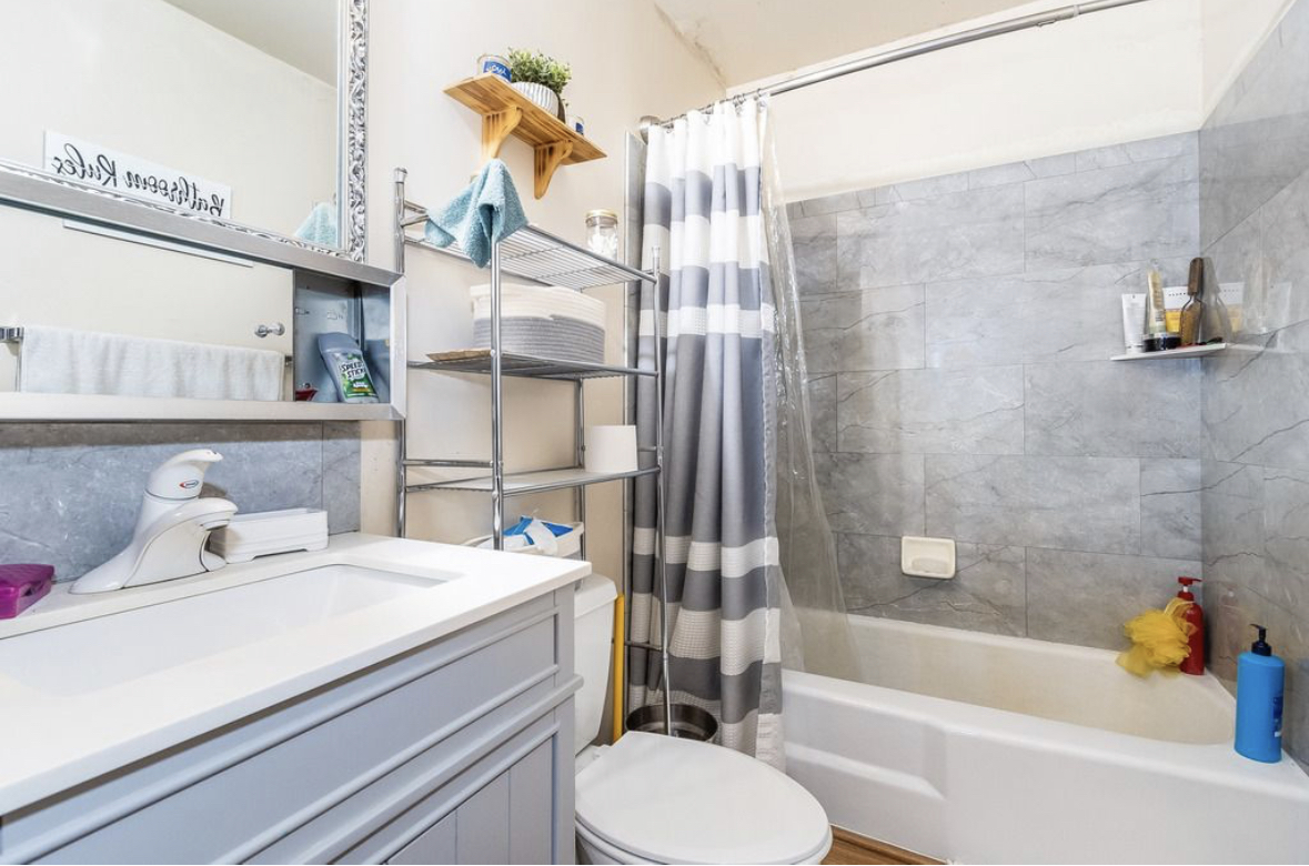 1943 Church Road Aurora, IL 60505 - Photo 22 of 31 a bathroom with a sink toilet and shower