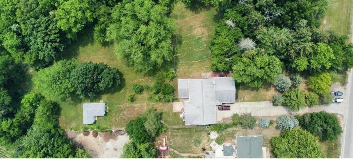 1943 Church Road Aurora, IL 60505 - Photo 26 of 31 an aerial view of a house with a yard and large trees