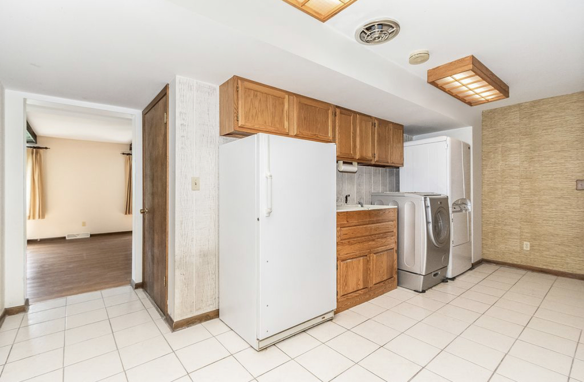 1943 Church Road Aurora, IL 60505 - Photo 7 of 31 a view of a kitchen with refrigerator and cabinet