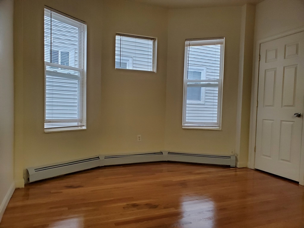 5 Coleman Street, Unit 2 Boston, MA 02125 - Photo 6 of 9 a view of a room with wooden floor and windows