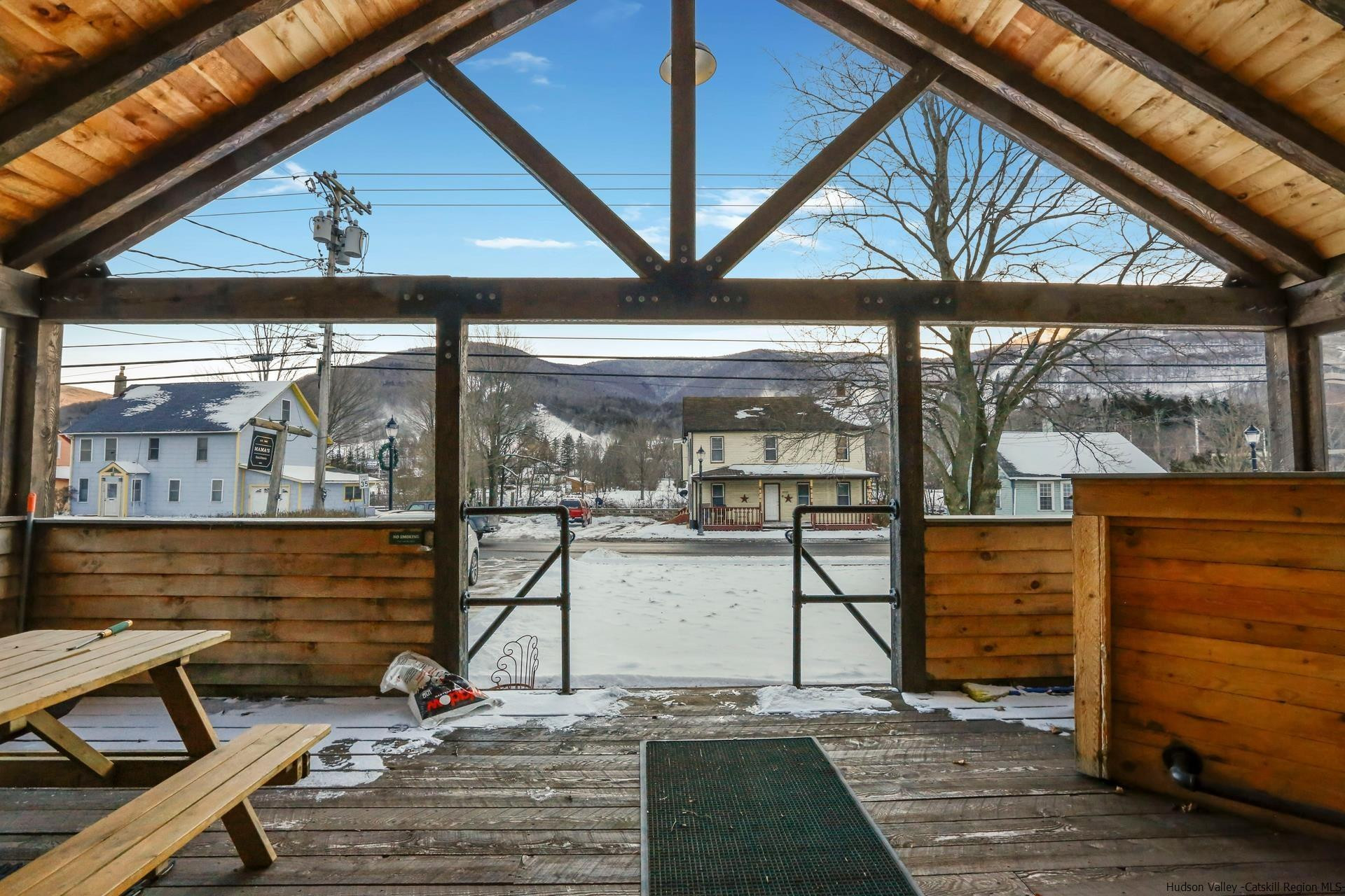 a view of a two chairs in the balcony