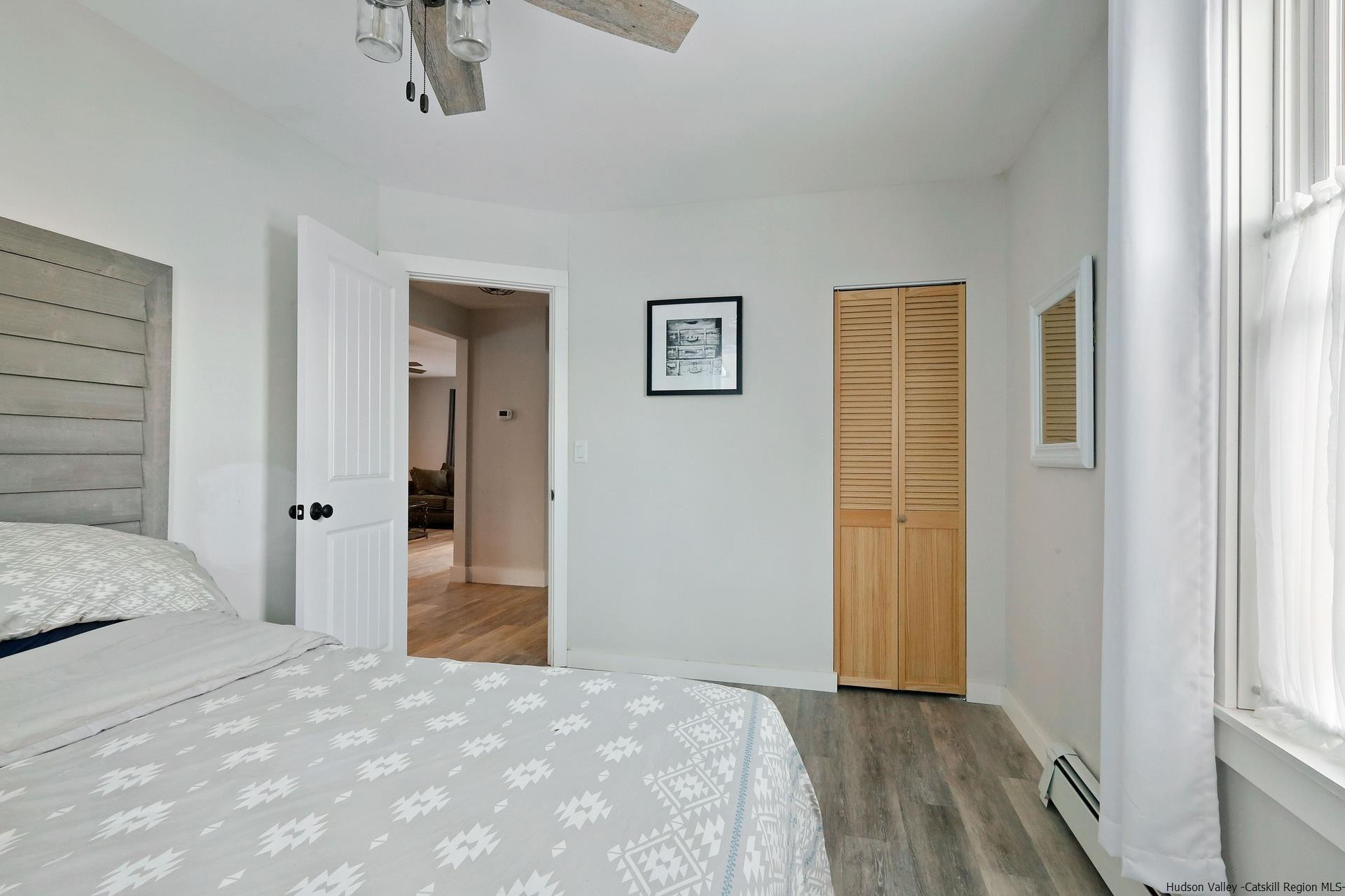 7732 Main Street Hunter, NY 12442 - Photo 13 of 25 a bedroom with a bed and a window