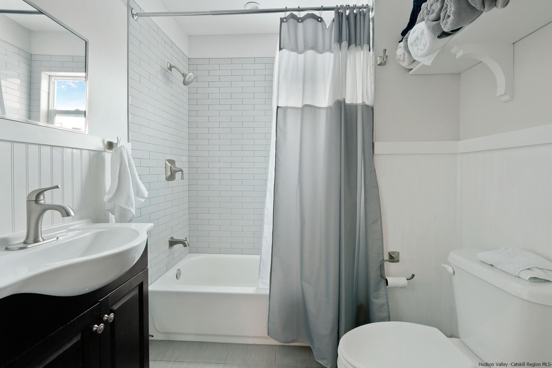 7732 Main Street Hunter, NY 12442 - Photo 14 of 25 a bathroom with a sink toilet and shower